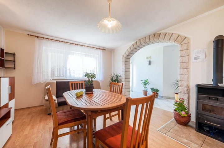 Dining room in a senior care home, friendly staff serving healthy Mediterranean meal